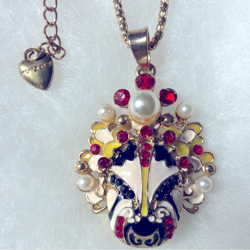 Enamel mask pendant with pearls and red stones on gold plated chain